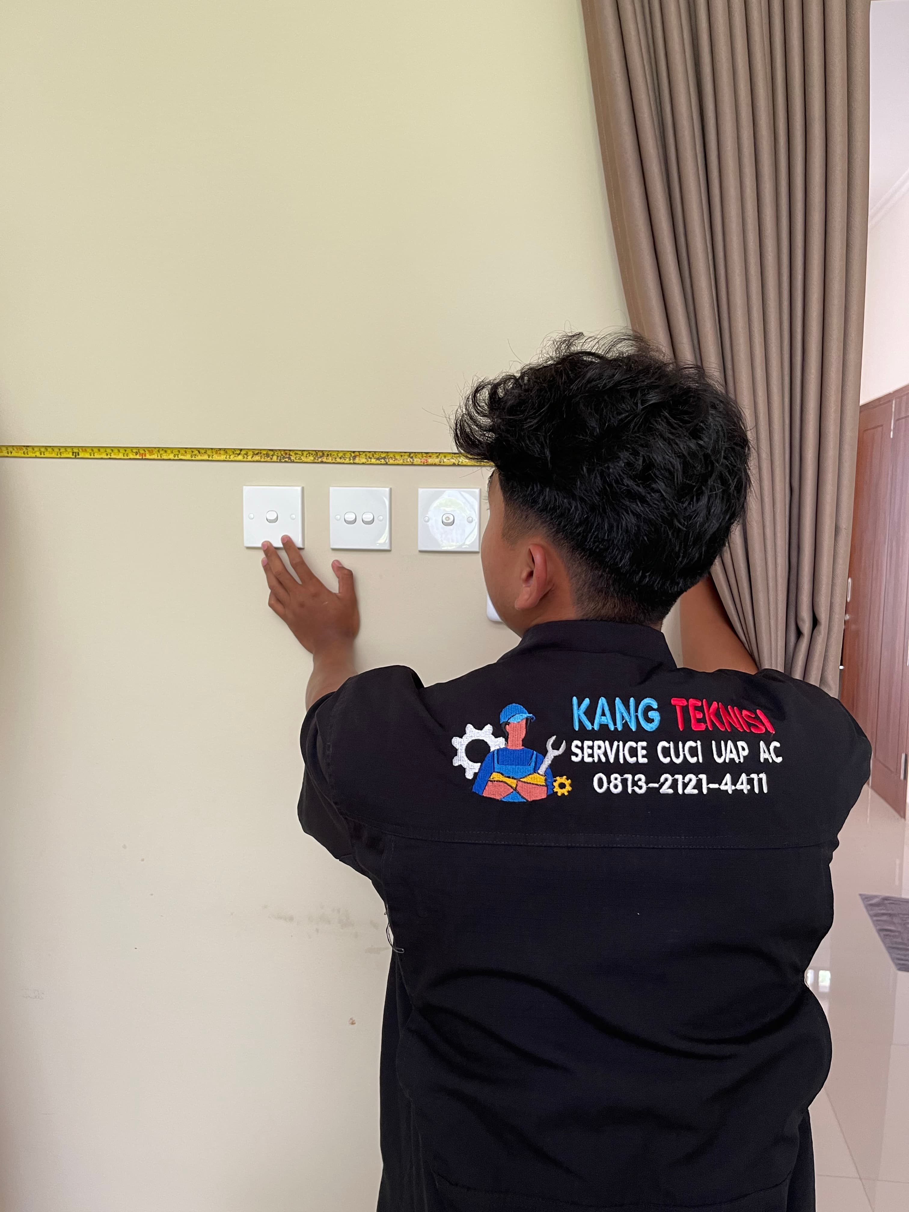 Technician repairing an AC unit